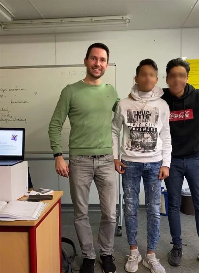 A participatory workshop session with students, faces blurred for privacy