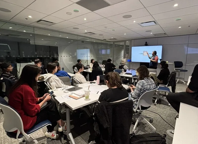 A presenter walking through a case study on screen at the Case Study Presentation Workshop